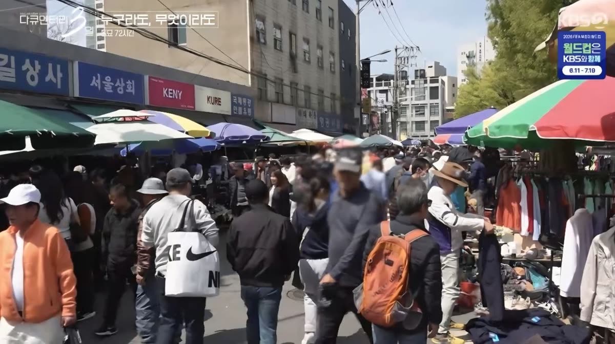 Dongmyo street market with clothing stalls and visitors