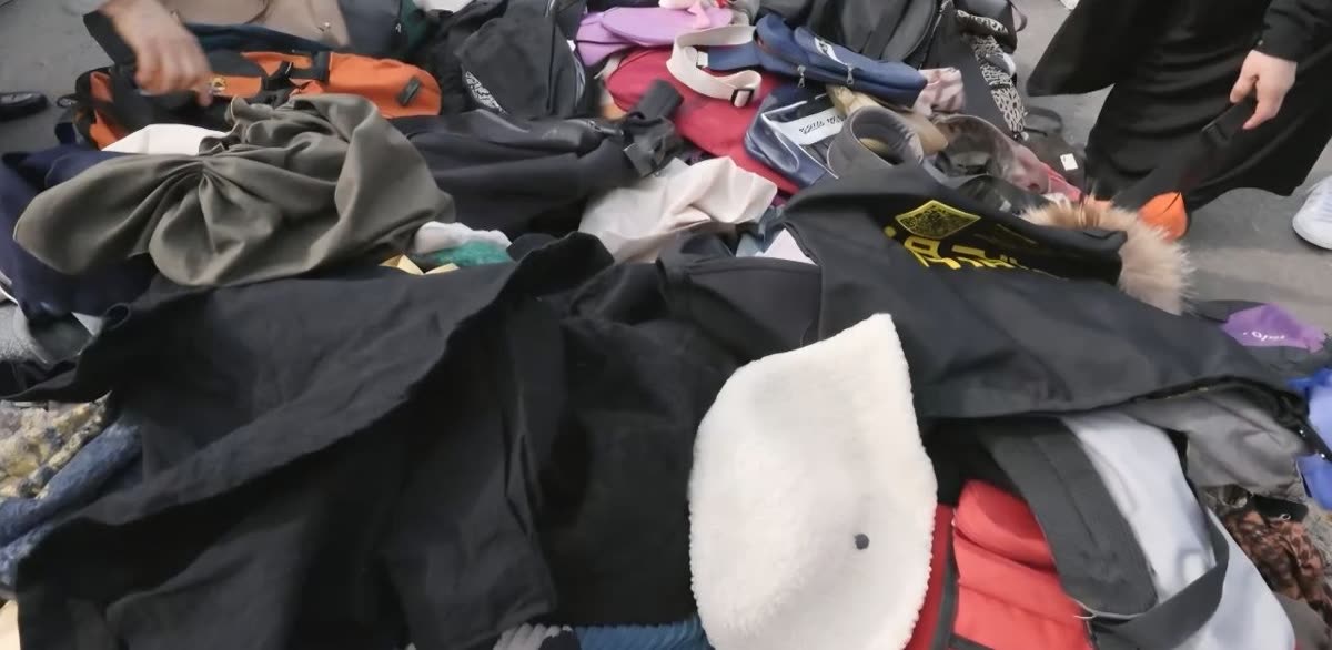 Vintage goods, bags, hats, and clothing piled in Dongmyo